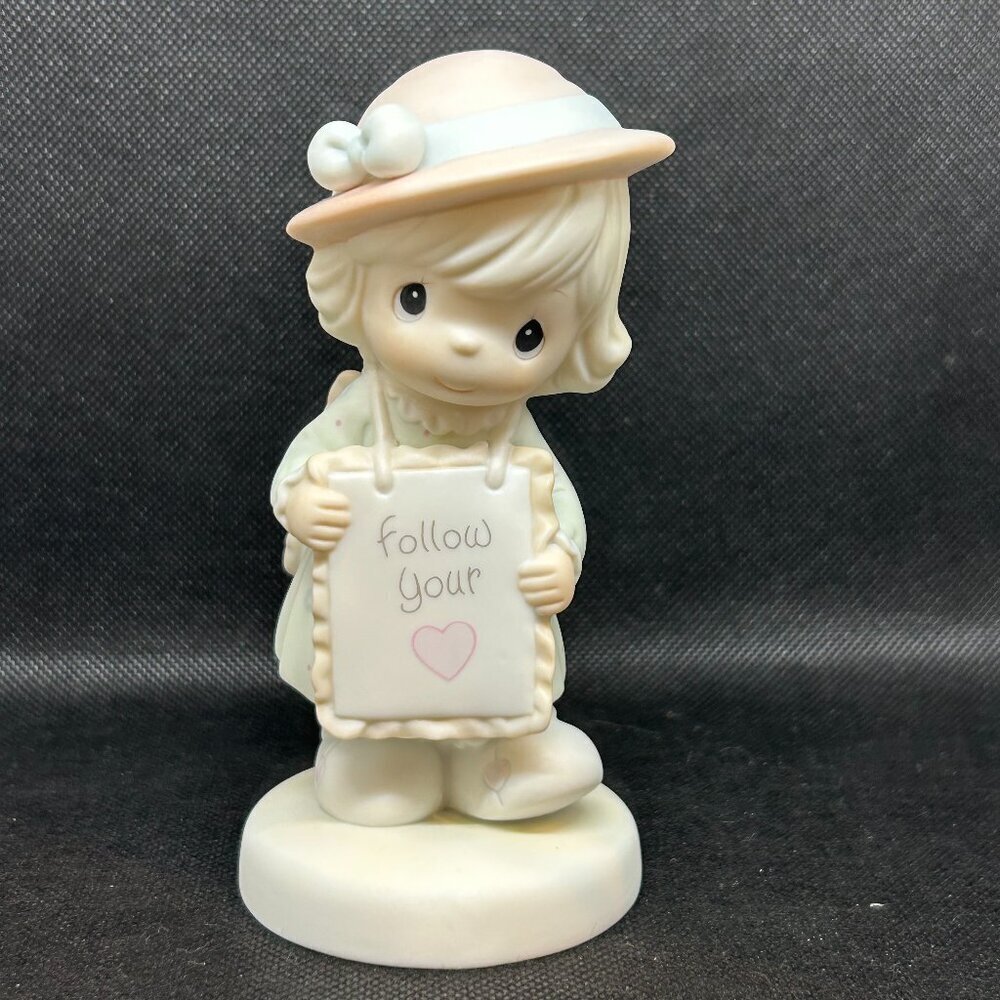Precious Moments “Follow Your Heart" figurine